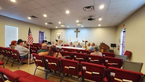 Residents at a Southern Oaks board meeting
